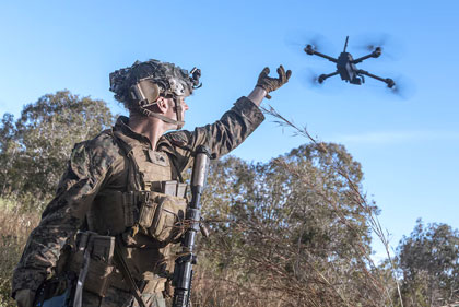 SMOOTH OPERATOR: Marine Corps Cpl. Calvin Burke activates a Skydio X2 small unmanned aerial system during a simulated assault and seizure at Glen Airfield in Queensland, Australia, July 7, 2025. USMC photo by Lance Cpl. Victor Gurrola.