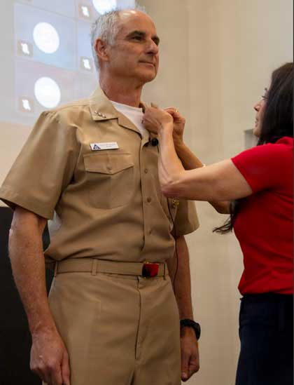 NAVAL AIR STATION NORTH ISLAND, Calif. (Feb. 2, 2026) – Rear Adm. Douglas “V8” Verissimo is pinned by his wife, Amanda Verissimo, to vice admiral during his promotion and change of command ceremony, as he assumes the title of commander, Naval Air Forces (CNAF) onboard Naval Air Station North Island, Feb. 2, 2026. The mission of CNAF is to man, train and equip deployable, combat-ready Naval Aviation forces that win in combat. U.S. Navy photo by MC3 James Peer.